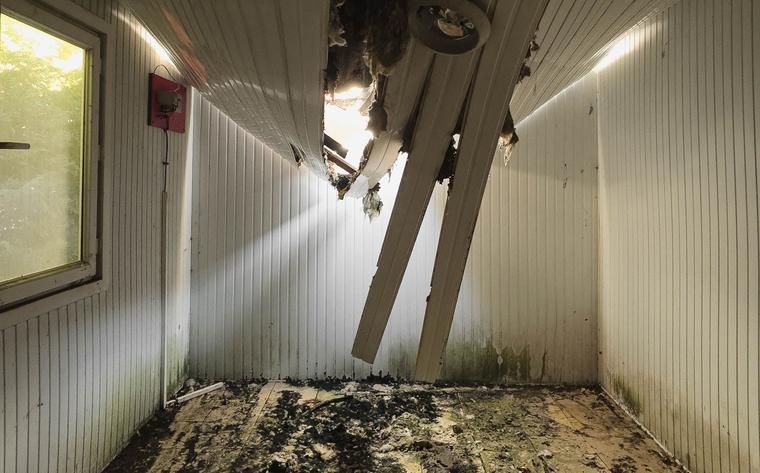 Room with a collapsed, water-damaged ceiling